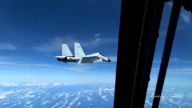 A Chinese jet fighter came within 20 feet of a U.S. Air Force RC-135 reconnaissance plane flying over the South China Sea.