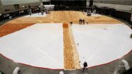Pizza Hut announced it broke the Guinness World Record for world's largest pizza by making a pizza with a surface area of 13,990 square feet.