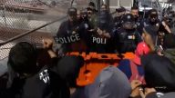 More than 1,000 migrants pushed back border authorities Sunday at the Santa Fe International Bridge in El Paso, Texas.