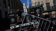 Trump called for his supporters to protest his arrest, which he expects to happen Tuesday. The NYPD set up barricades on Monday.